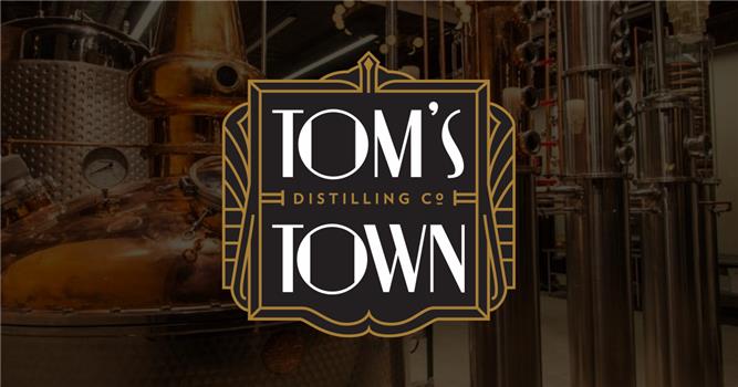 Tom's Town Distillery logo